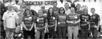 The 13 strong Cocktail Crew pose for a group photograph.