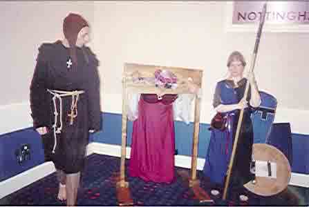 Picture of an attendee in the stocks.