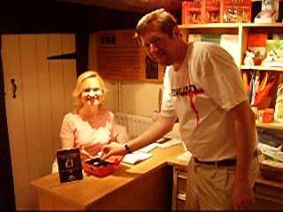 Alistair paying Wendy his entrance fee